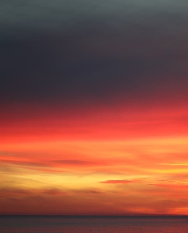 The Sky Caught Fire and Forgot the Sea